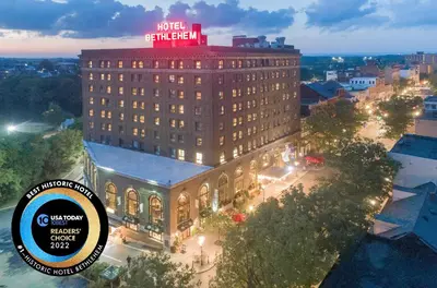 a large building with a sign on top of it at Historic Hotel Bethlehem in Bethlehem