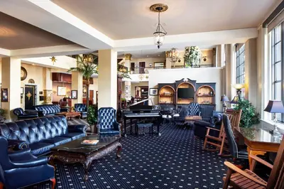 a hotel lobby with couches and a piano at Historic Hotel Bethlehem in Bethlehem