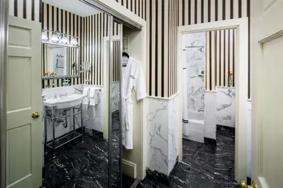 a bathroom with a sink and a shower and a toilet at Historic Hotel Bethlehem in Bethlehem
