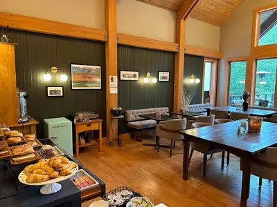 a large room with tables and chairs and food on display at Minnewaska Lodge in Gardiner