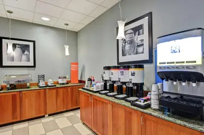 a store with a counter with bottles of wine at Hampton Inn Lewisburg in Lewisburg