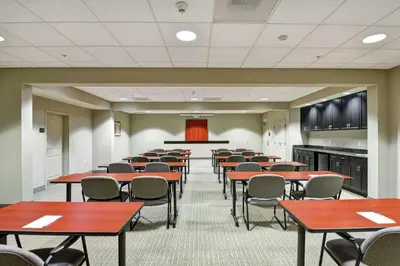 a large room with tables and chairs and a podium at Hampton Inn Lewisburg in Lewisburg