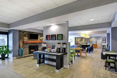 a lobby of a hospital with a fireplace at Hampton Inn Sayre in Sayre