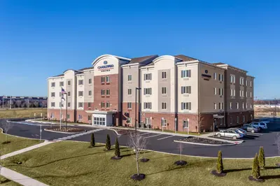 an aerial view of a building with a parking lot at Candlewood Suites Bethlehem South by IHG in Bethlehem