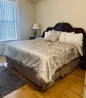 a bedroom with a large bed with white pillows at Hotel Belvidere in Belvidere