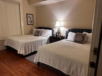 a bedroom with two beds and a lamp at Hotel Belvidere in Belvidere
