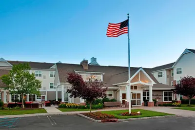 an american flag flying in front of a building at Residence Inn Bridgewater Branchburg in Branchburg Park