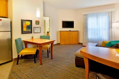 a hotel room with a kitchen and a living room at Residence Inn Bridgewater Branchburg in Branchburg Park