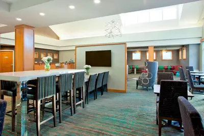 a conference room with a long table and chairs at Residence Inn Bridgewater Branchburg in Branchburg Park