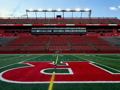 a football stadium with a red and green field at Garden Executive Hotel in South Plainfield