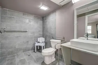 a bathroom with a toilet and a sink at Motel 6 Carlisle, PA - Cumberland Valley in Carlisle