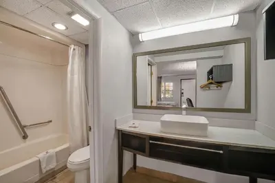 a bathroom with a sink and a mirror at Motel 6 Carlisle, PA - Cumberland Valley in Carlisle