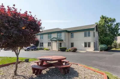 a picnic table in front of a building at Super 8 by Wyndham Harrisburg Hershey West in Harrisburg