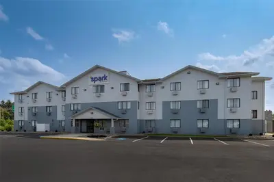 a large apartment building with a parking lot at Spark by Hilton Carlisle South in Carlisle