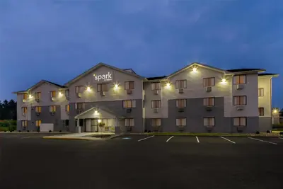 a large building with a parking lot in front of it at Spark by Hilton Carlisle South in Carlisle