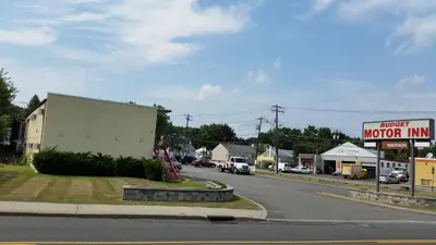 a street in a small town with a motel at Budget Motor Inn- Stony Point in Stony Point