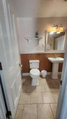 a bathroom with a toilet and a sink at Greystone Manor Bed & Breakfast in Bird in Hand