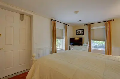 a bedroom with a large bed and a television at Greystone Manor Bed & Breakfast in Bird in Hand