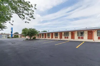 an empty parking lot in front of a building at Scottish Inns Harrisburg-Hershey South in New Cumberland