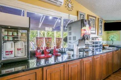 a kitchen with a counter with a counter at Scottish Inns Harrisburg-Hershey South in New Cumberland