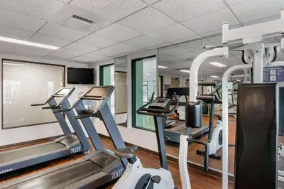 a gym with treadmills and elliptical machines at Sleep Inn Carlisle South in Carlisle