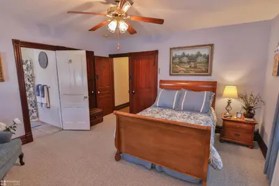 a bedroom with a bed and a ceiling fan at Lizard Creek Inn in Andreas