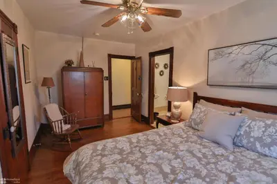 a bedroom with a bed and a ceiling fan at Lizard Creek Inn in Andreas