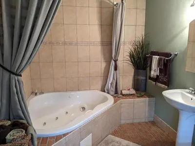 a bathroom with a bath tub and a sink at Lizard Creek Inn in Andreas