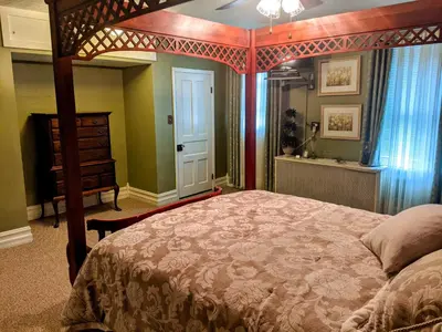 a bedroom with a bed and a dresser in it at Lizard Creek Inn in Andreas