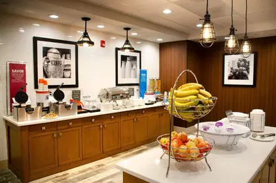 a kitchen with a bunch of fruit on a counter at Hampton Inn Lebanon in Lebanon