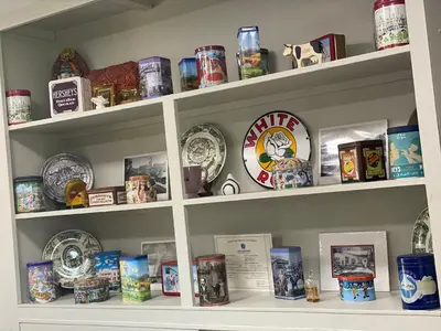 a shelf filled with lots of plates and bowls at White Rose Motel - Hershey in Hershey