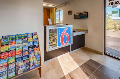 a krispy kreme store with a sign on the wall at Motel 6-Drums in Drums