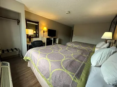 a hotel room with a bed and a television at Super 8 by Wyndham Allentown Kutztown Area in Kutztown