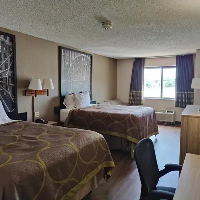 a hotel room with two beds and a window at Super 8 by Wyndham Allentown Kutztown Area in Kutztown