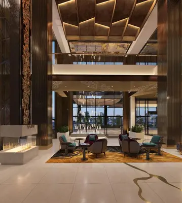 a lobby with chairs and tables in a building at Wind Creek Bethlehem Casino & Resort in Bethlehem