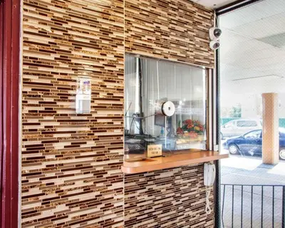 a brick wall with a counter in a store at Rodeway Inn Meadowlands in Secaucus