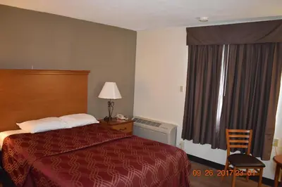 a hotel room with a bed and a window at MHO Hotel Bordentown in Bordentown