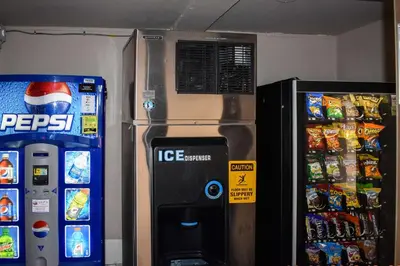 a ice machine next to a pepsi and a refrigerator at MHO Hotel Bordentown in Bordentown