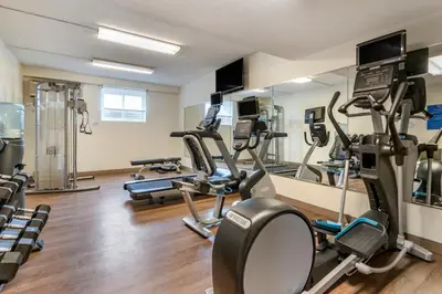 a gym with several treadmills and elliptical machines at Holiday Inn Express Jonestown Ft Indiantown Gap by IHG in Jonestown
