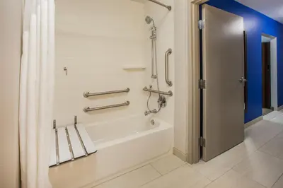 a bathroom with a bath tub with a shower curtain at Holiday Inn Express Jonestown Ft Indiantown Gap by IHG in Jonestown