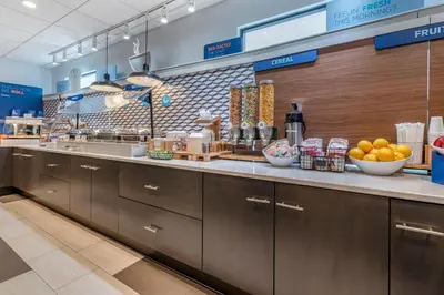 a kitchen with a counter with bowls of fruit on it at Holiday Inn Express Jonestown Ft Indiantown Gap by IHG in Jonestown