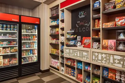 a grocery store aisle with shelves of food at Hampton Inn & Suites Hershey Near the Park in Hummelstown
