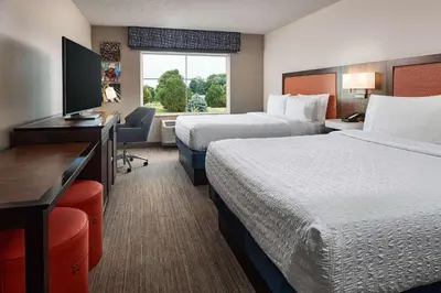 a hotel room with two beds and a desk at Hampton Inn & Suites Hershey Near the Park in Hummelstown
