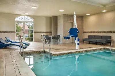 a pool in a hotel room with a swimming pool at Hampton Inn & Suites Hershey Near the Park in Hummelstown