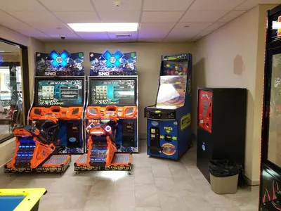 a room with three arcade games and two video game machines at Chateau Resort & Conference Center in Tannersville