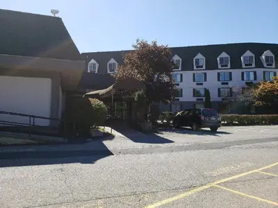 a car parked in a parking lot next to a building at Chateau Resort & Conference Center in Tannersville