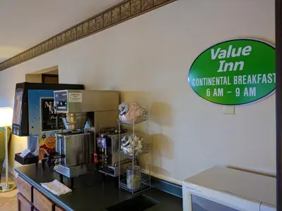 a coffee shop with a sign on the wall at Value Inn Harrisburg-York in Valley Green