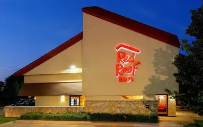 a building with a red rock sign on it at Red Roof Inn Harrisburg - Hershey in Harrisburg