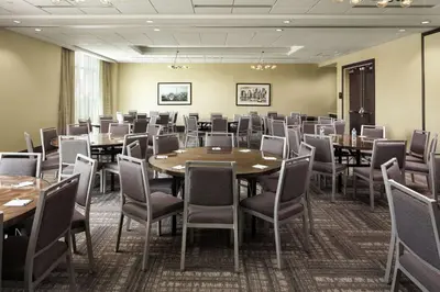 a conference room with tables and chairs in it at Hampton Inn & Suites Teaneck/Glenpointe in Teaneck