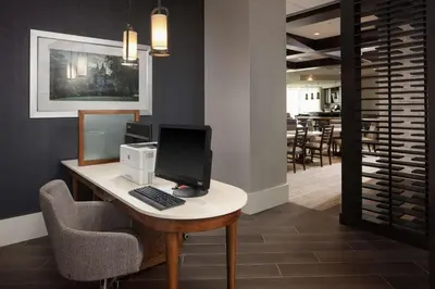 a desk with a computer on top of it at Homewood Suites By Hilton Teaneck Glenpointe in Teaneck